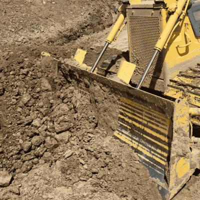 Straight dozer blade on Komatsu bulldozer by Enstruc for grading and earthmoving