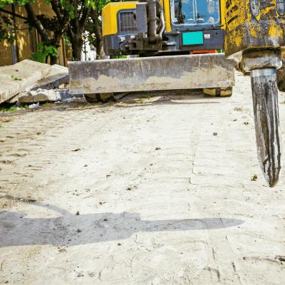 Enstruc hydraulic hammer in operation on mini excavator for breaking concrete